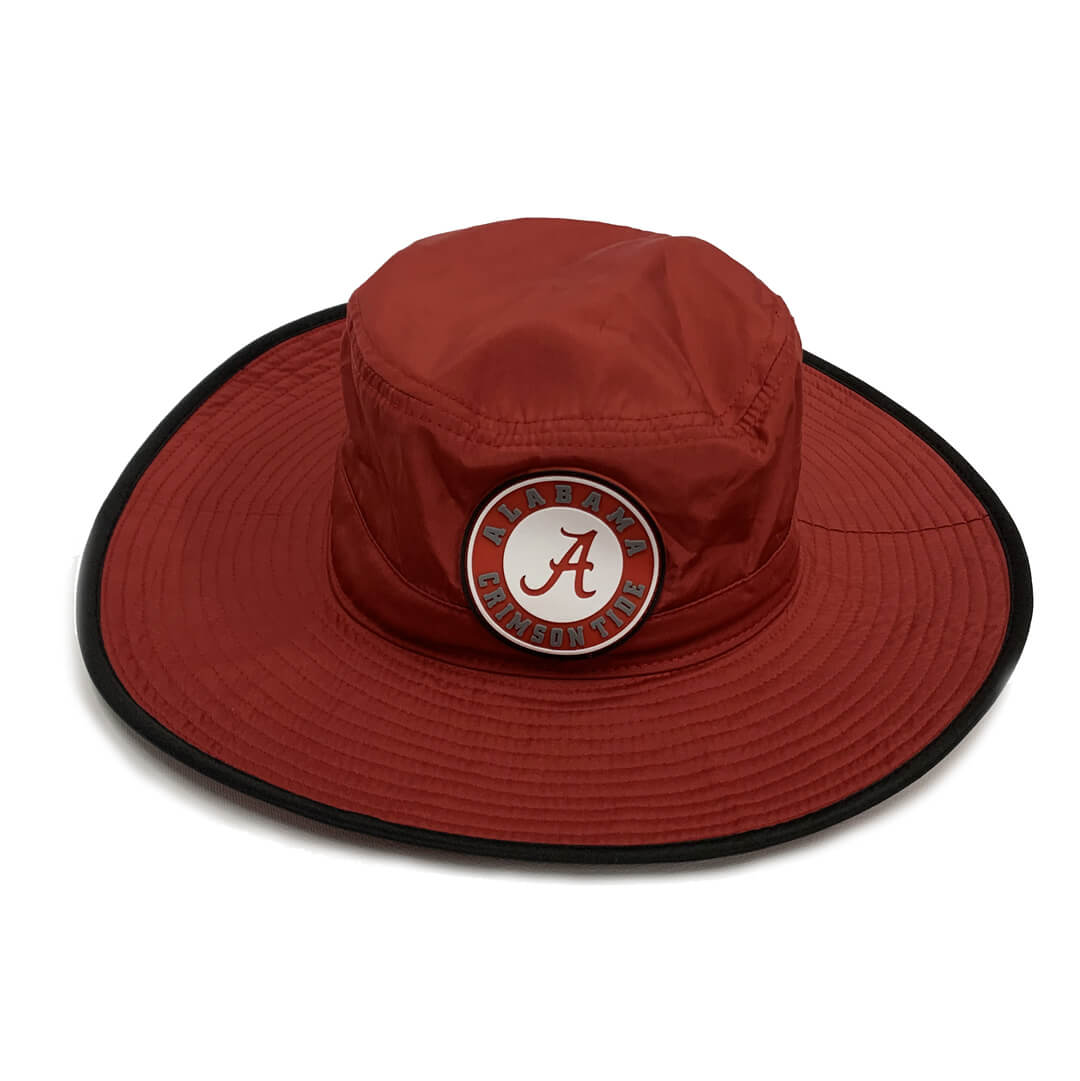 A red bucket hat featuring a circular patch with the Alabama Crimson Tide logo in the cetner.