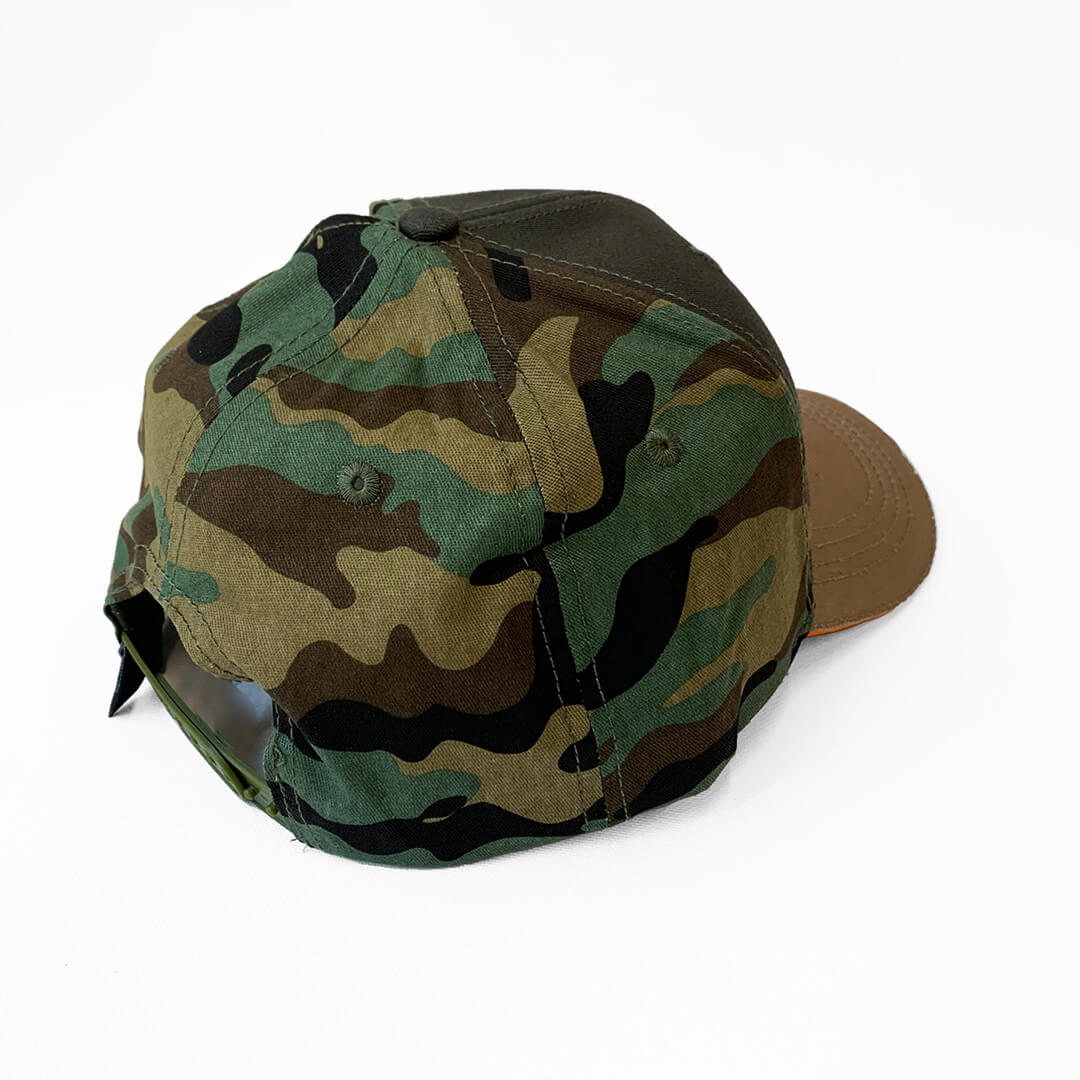Back view showing a camouflage backing and snapback.