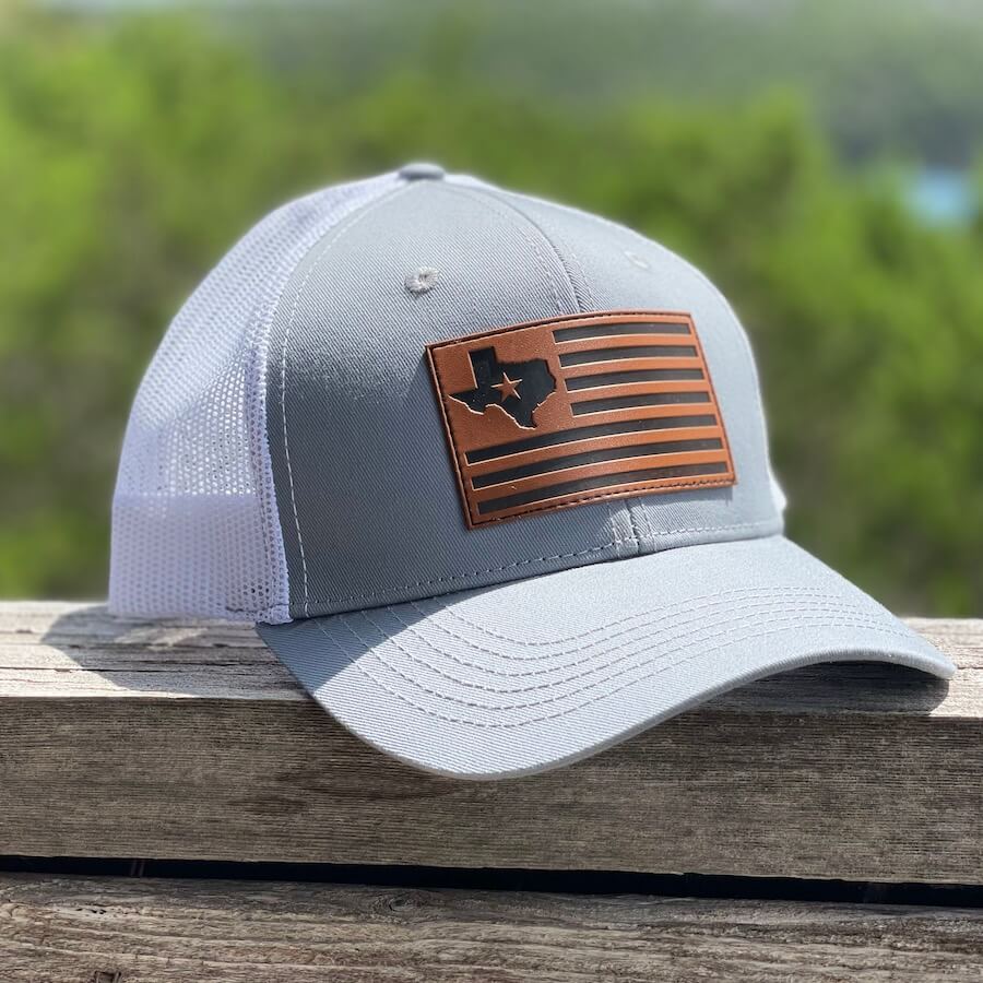 Lifestyle image of the hat sitting on a wooden ledge.