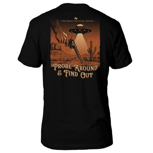 Black t-shirt with a graphic design of a cowboy hand holding a gun, UFO, and desert landscape on the back.